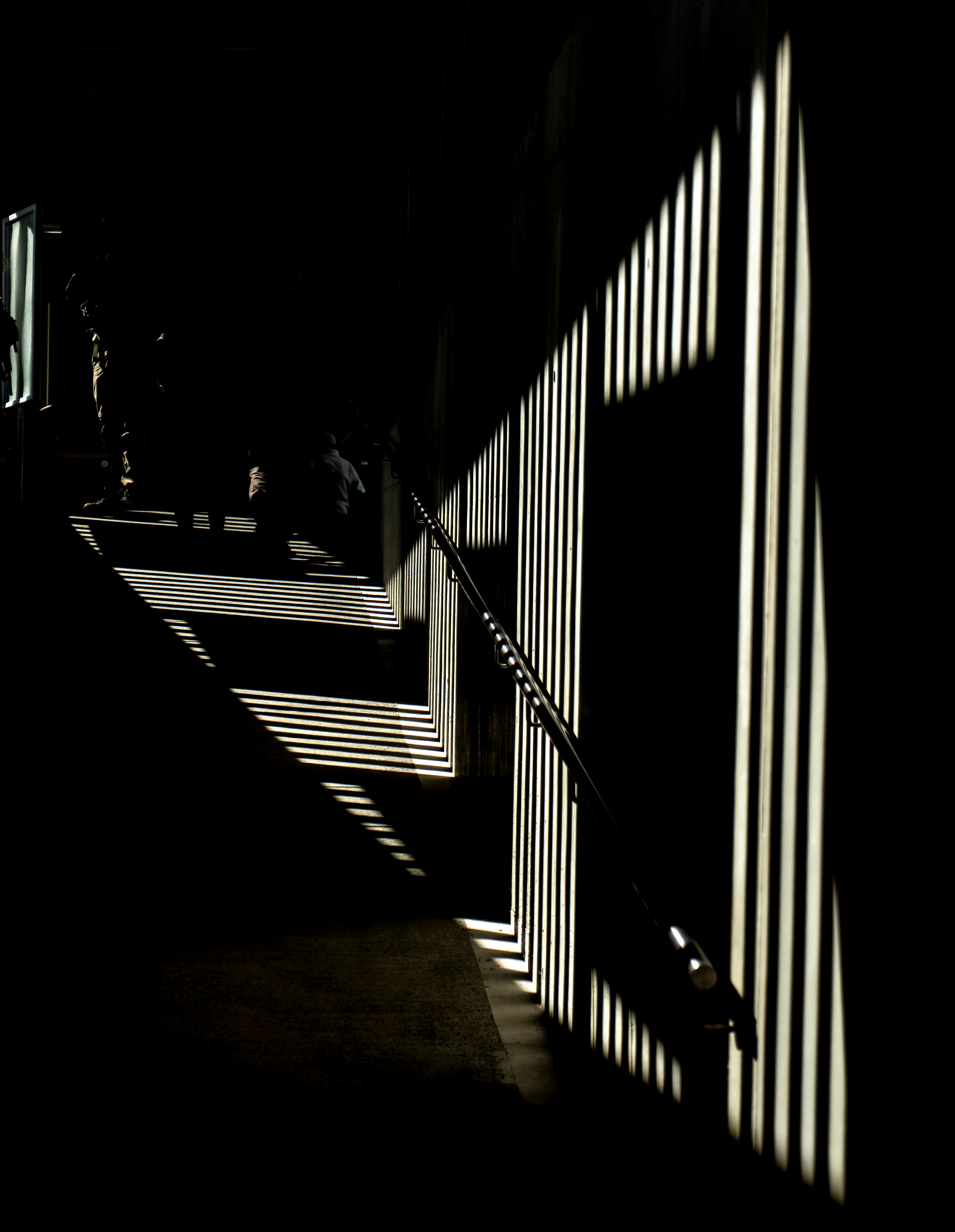 silhouette of person walking on hallway